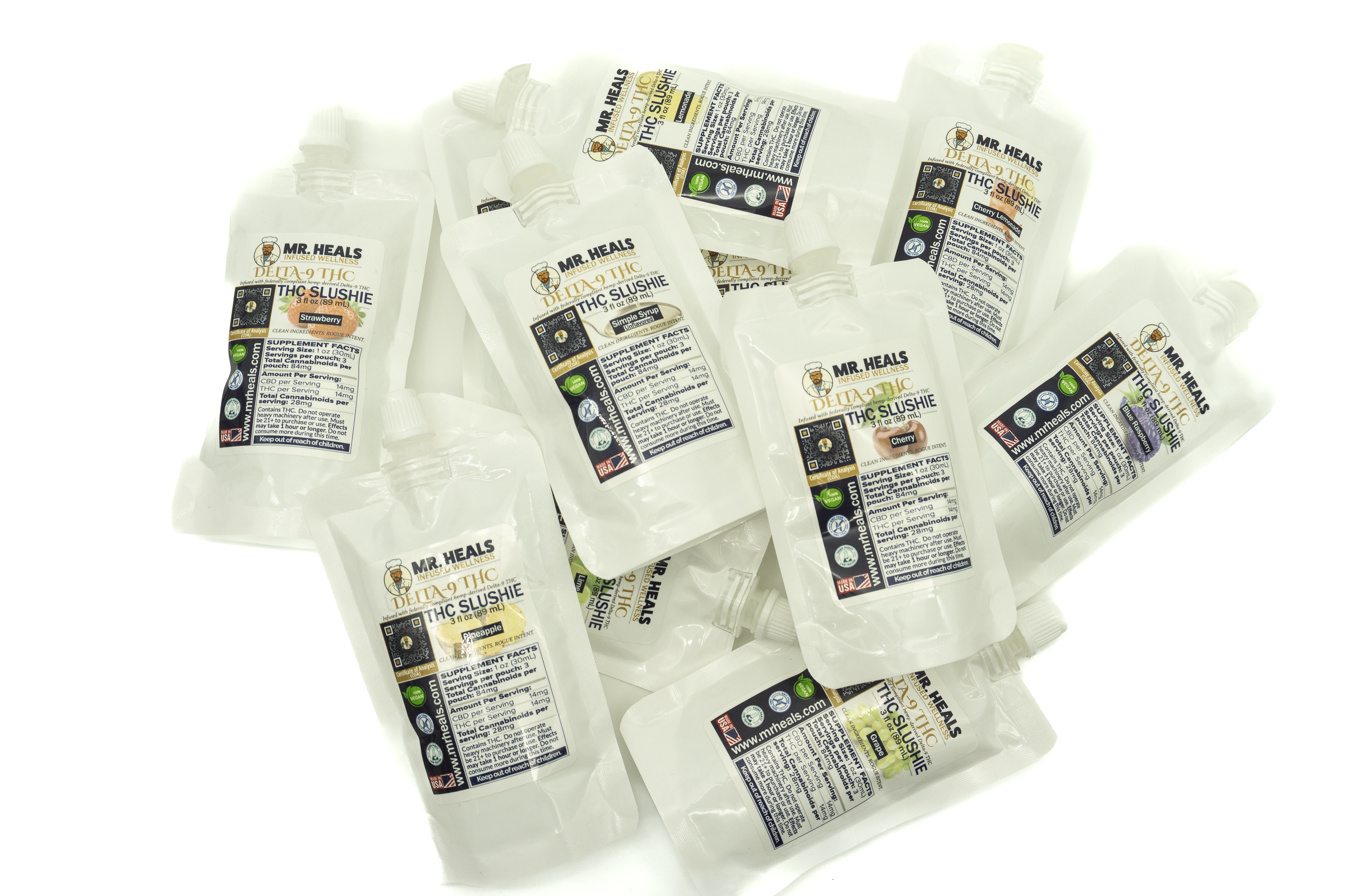 Multiple packages of Mr. Heals THC Slushies lying flat on a white background