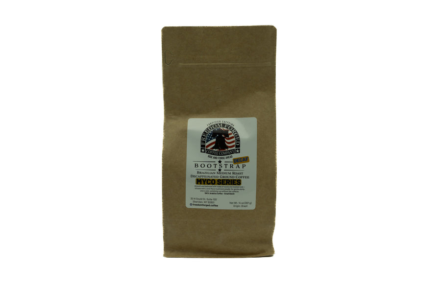 Kraft brown coffee bag with a label on a white background