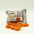 Packaged orange slices with 'Mr. Heals' branding on a white background