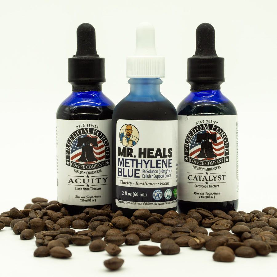 Three bottles of 'Mr. Heals' methylene blue solution with coffee beans on a white background