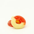 Two gummy candies, one red and one yellow, on a white background