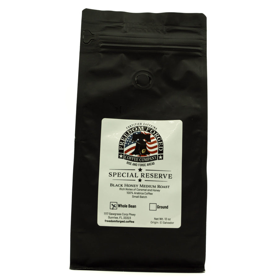 Black coffee bag with a label on a white background