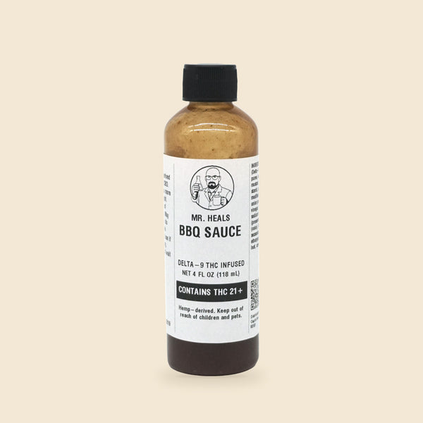 Mr. Heals Delta-9 THC BBQ Sauce, 4 fl oz bottle on parchment background