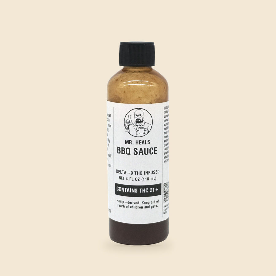 Mr. Heals Delta-9 THC BBQ Sauce, 4 fl oz bottle on parchment background