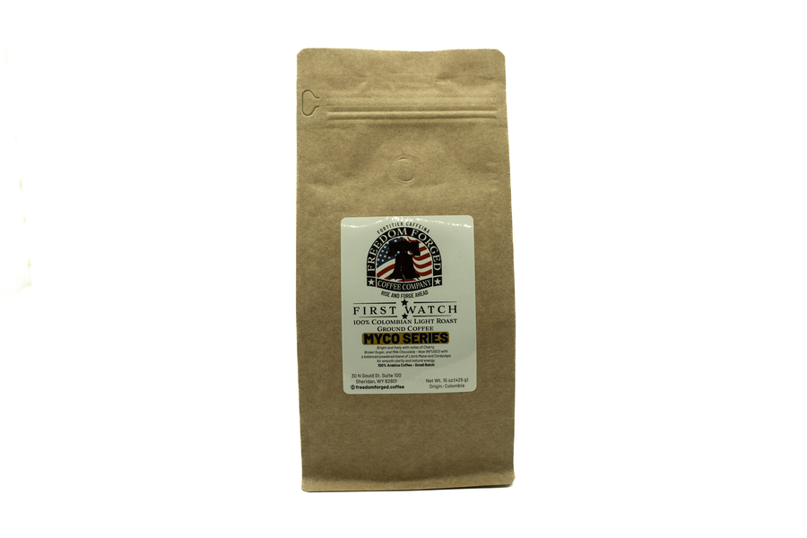 Kraft brown coffee bag with a label on a white background