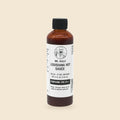 Mr. Heals Delta-9 THC Louisiana Hot Sauce, 4 fl oz bottle on parchment background