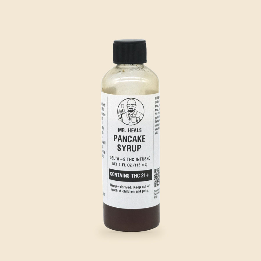 Mr. Heals Delta-9 THC Pancake Syrup, 4 fl oz bottle on parchment background